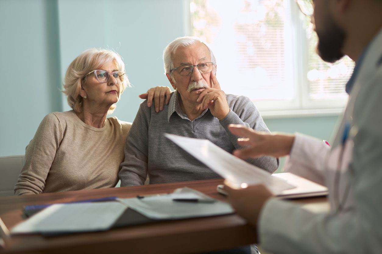 Senior couple having a consultation with a doctor in the office
