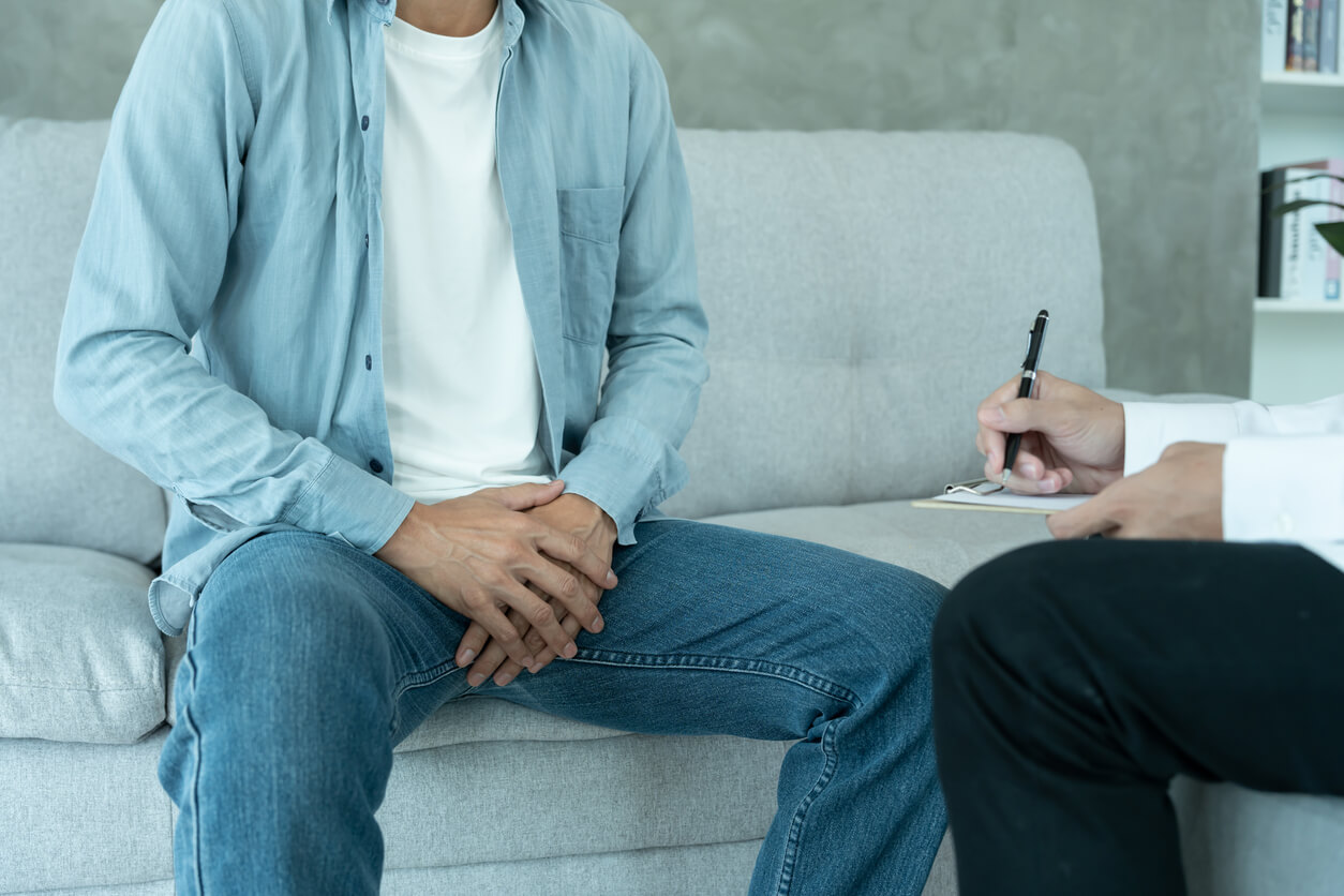Man hold hand in front of private parts feeling discomfort and consult doctor. Venereal, testicular cancer. bladder problems, erectile dysfunction, premature ejaculation, prostate cancer